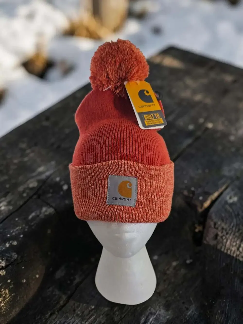Carhartt Women's Lookout Pom Cuffed Knit Beanie Hat in Rust Orange
